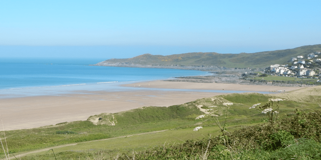 A wide shot of Woolacombe Beach, a five minute drive from Lower Campscott when staying on a special offer.