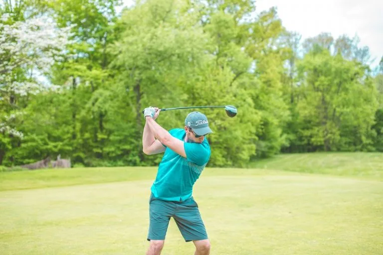 Man playing golf near Lower Campscott Farm as part of an active holiday in North Devon