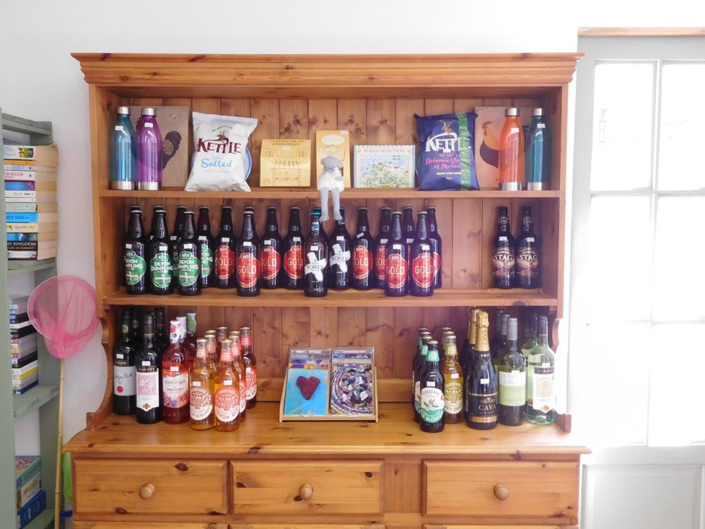 A selection of beer, wine and cider in the shop at Lower Campscott. Some of the food in Devon available to guests.