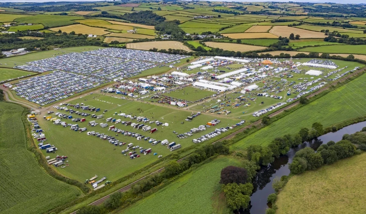 Aerial view of the North Devon Show, a family day out close to Lower Campscott. Green field with tents & cars.