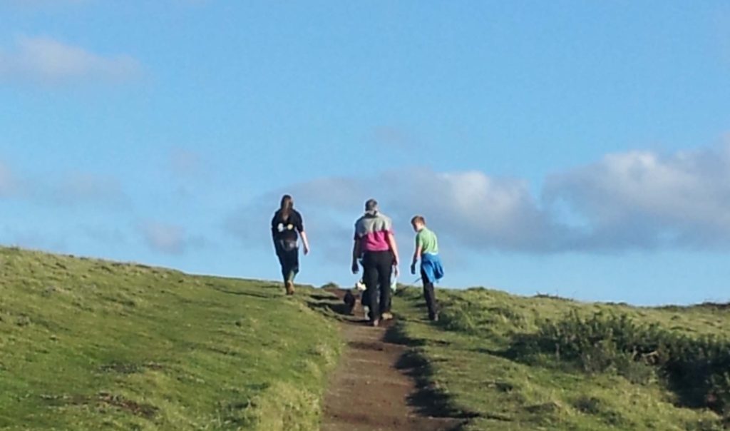 Three figures on a North Devon walking holiday.